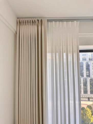 Layered drapery over sheer, ceiling track installation